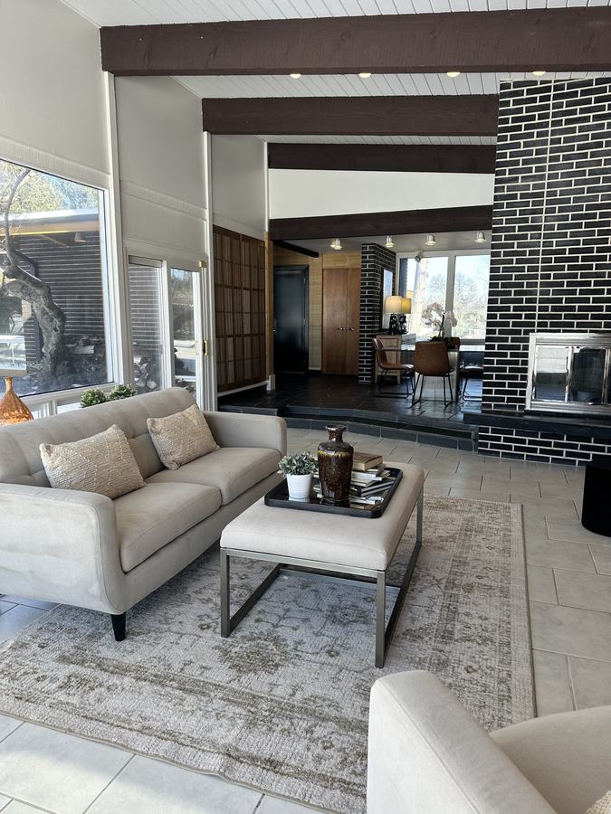 The same living room cleared, painted and staged